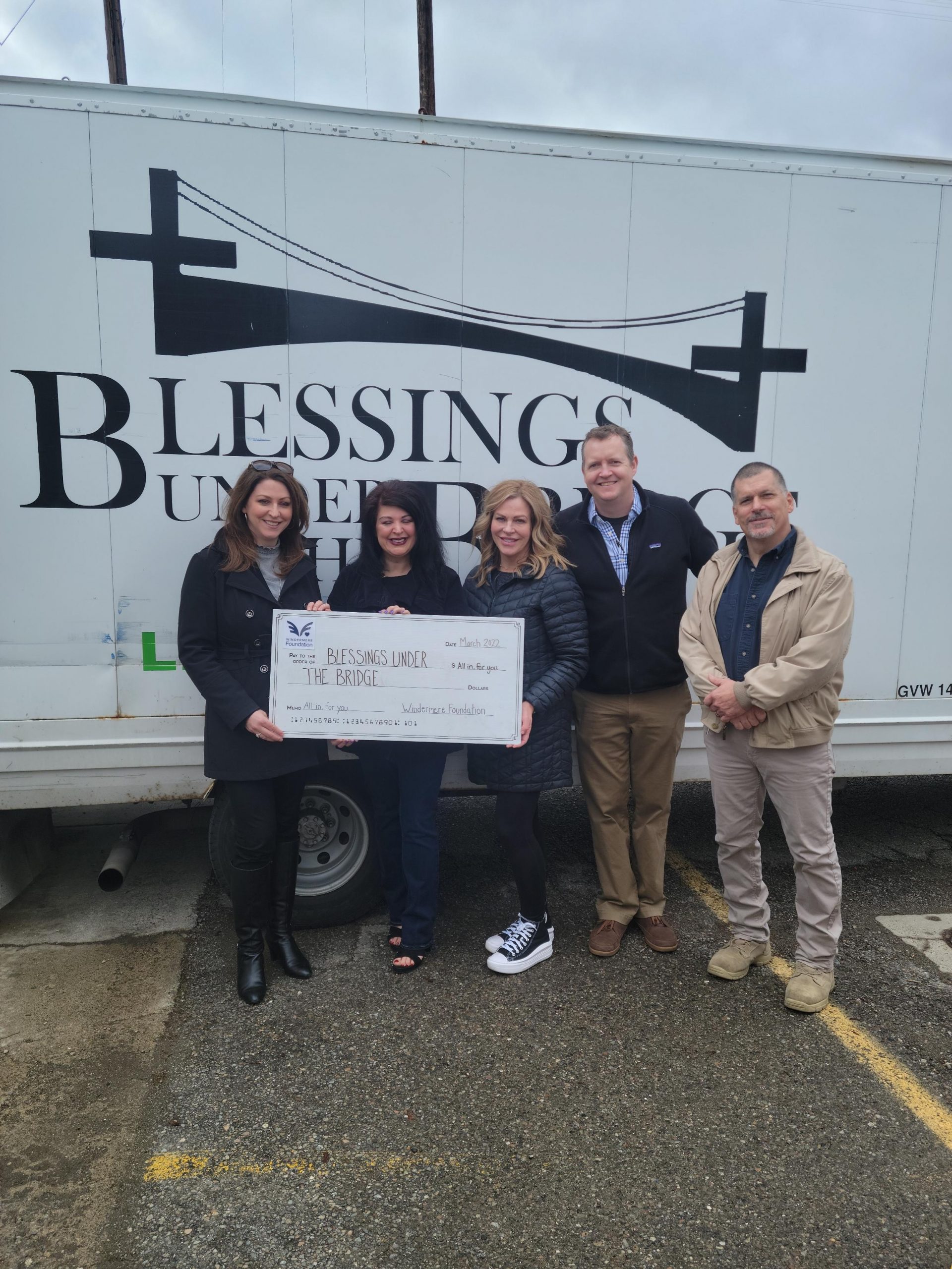 Blessings-Under-the-Bridge- organization with lifesize donation check