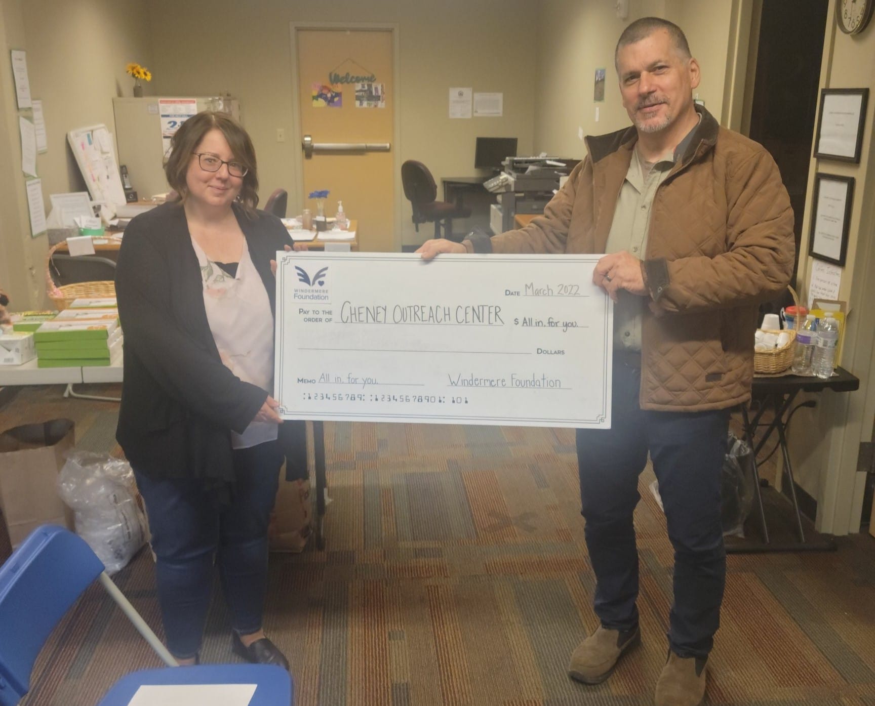 Cheney-Outreach-Center organization with lifesize donation check