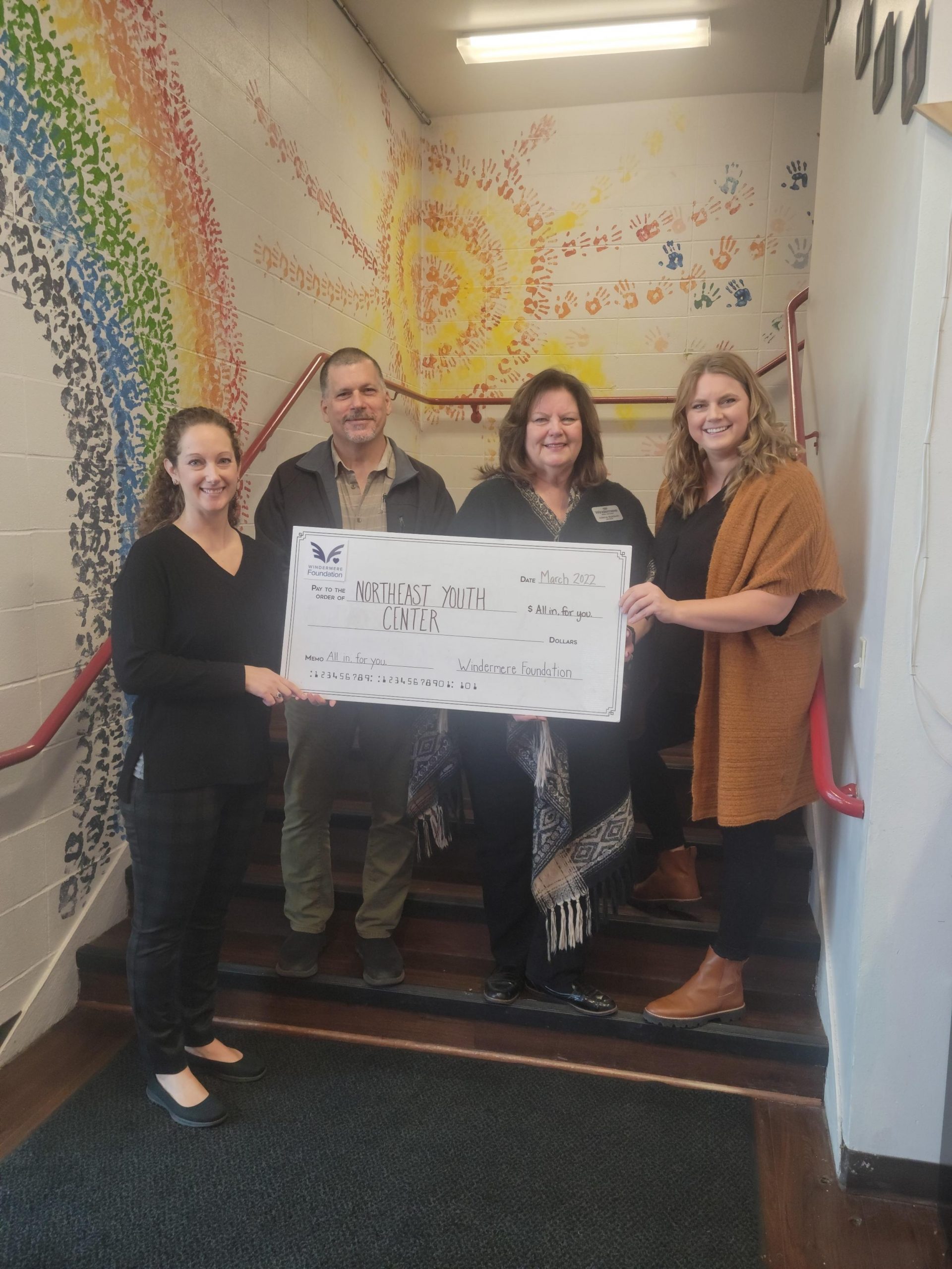 Northeast-Youth-Center organization with lifesize donation check