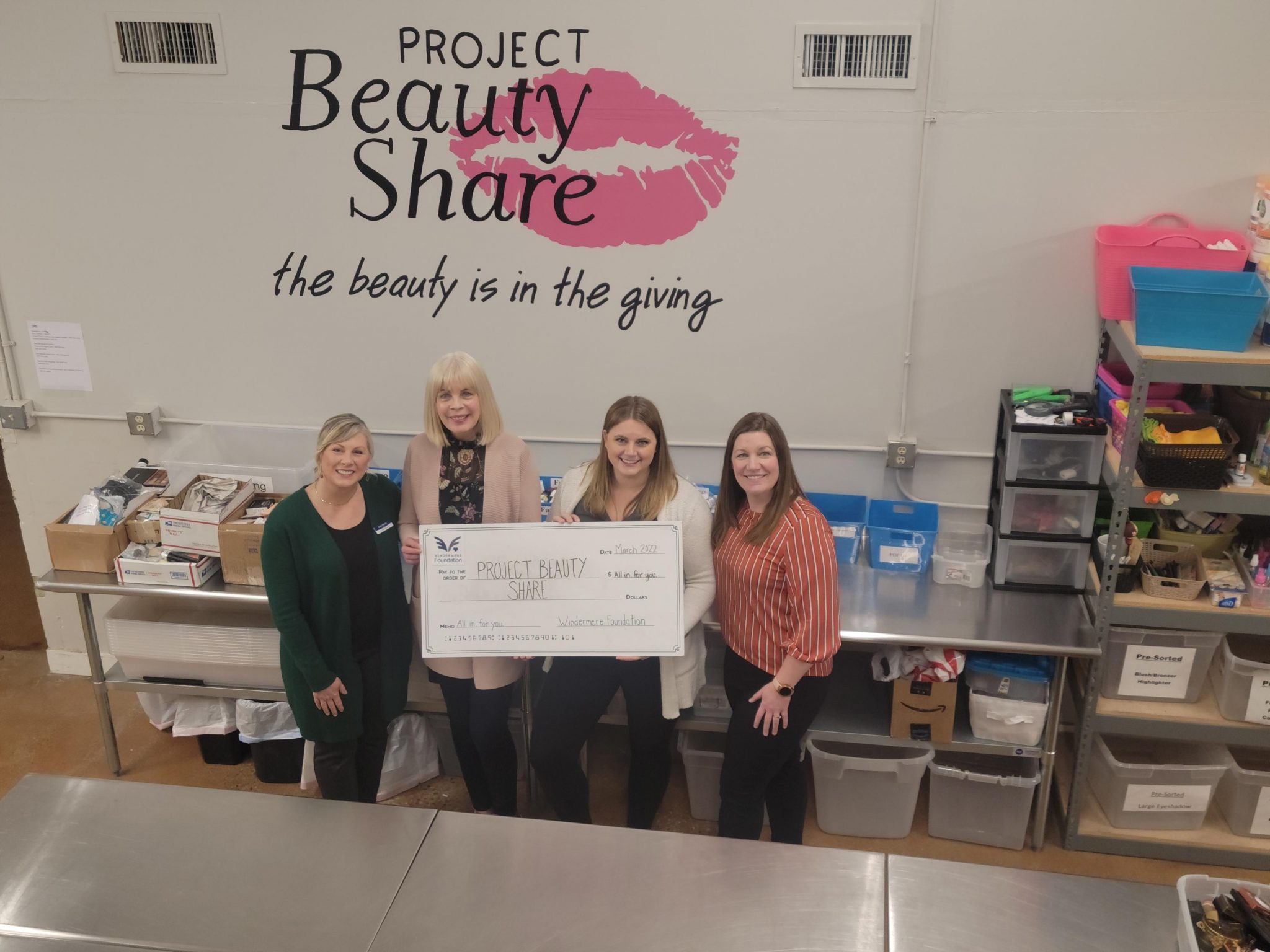 Project-Beauty-Share organization with lifesize donation check