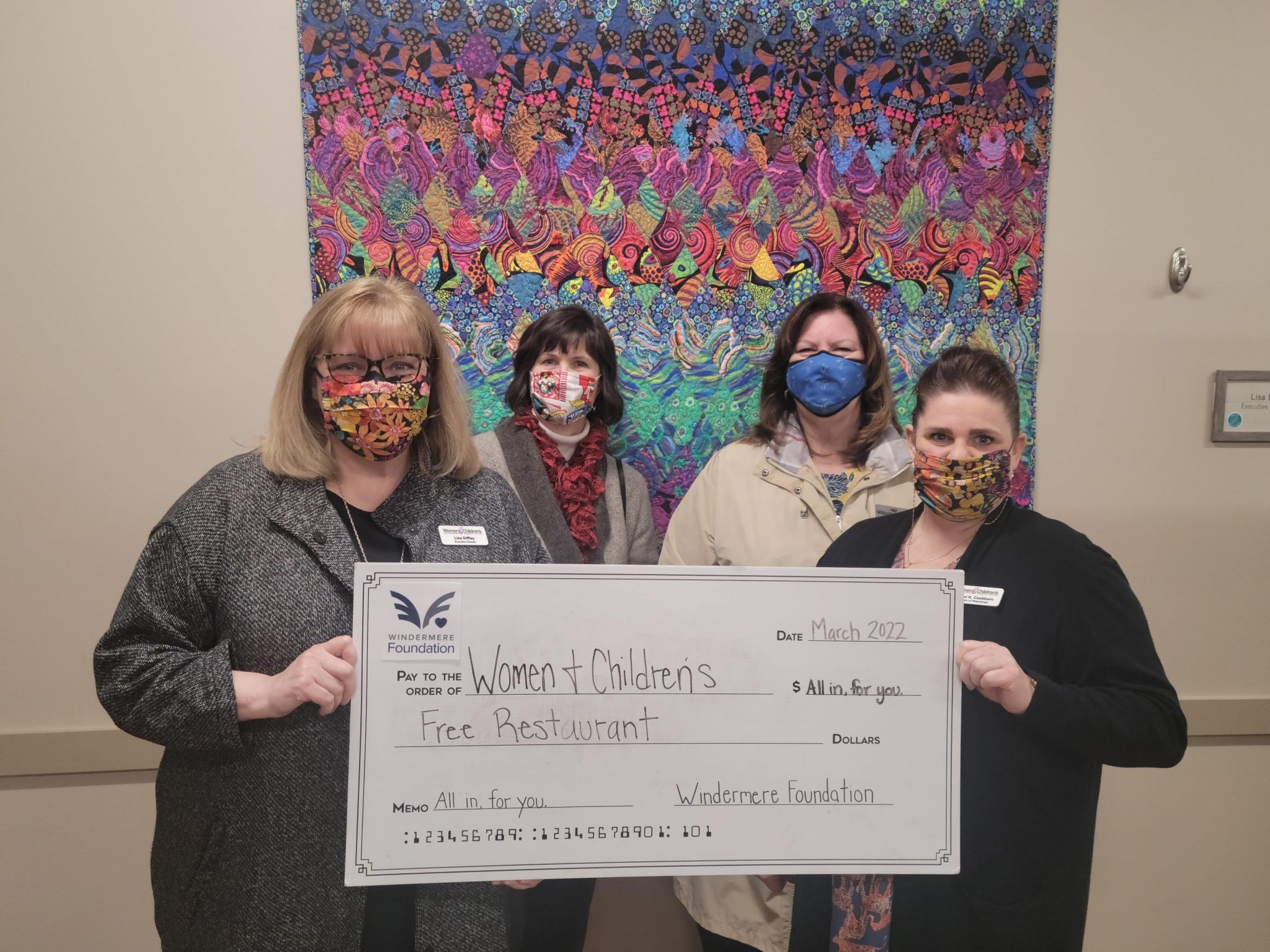 Women-and-Childrens-Free-Restraunt-with lifesize donation check
